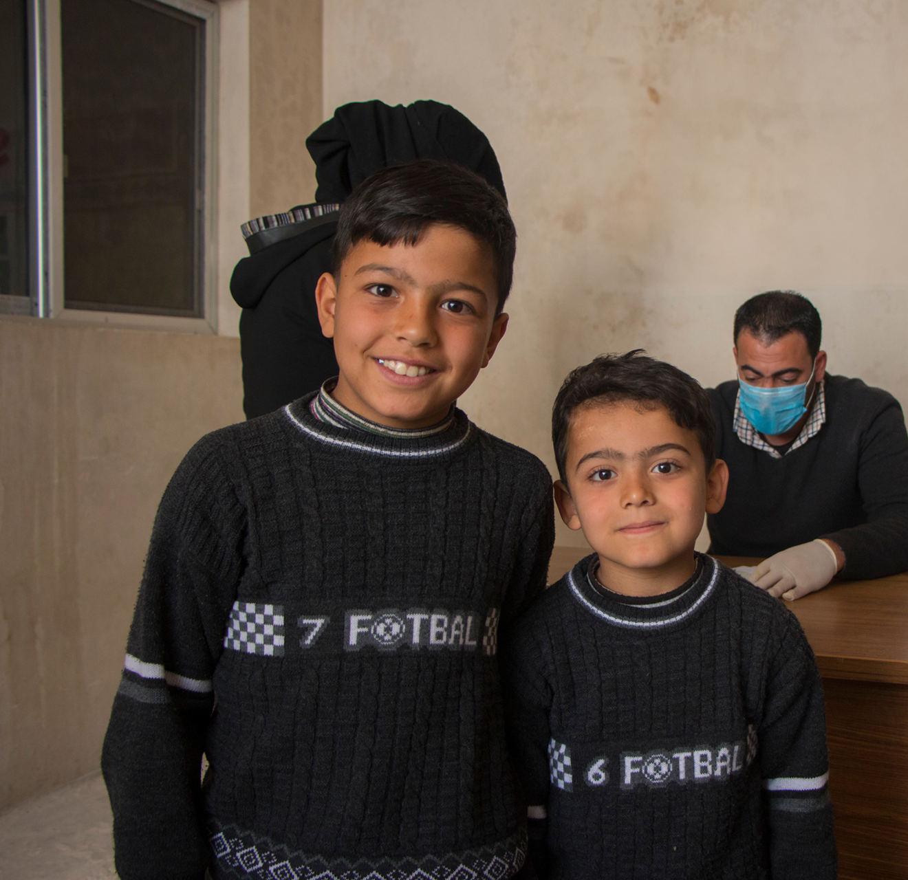 Syrian girl smiling in refugee camp